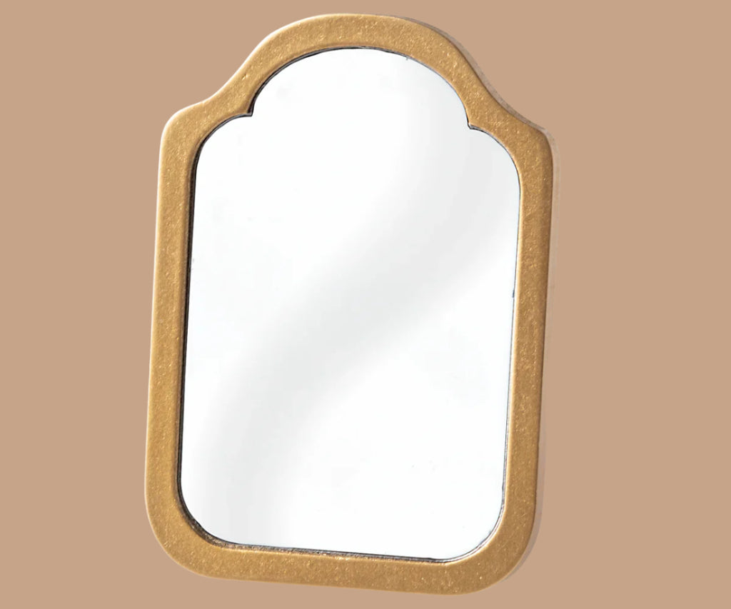 A gold, arched wall mirror with smooth edges and a reflective surface creates a charming backdrop for your Maileg Moms Afternoon Tea Set or warmly welcomes your favorite Maileg Mum Mouse.