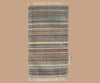 A rectangular Maileg Lounge Set rug with horizontal stripes in blue, brown, cream, and tan, fringed edges, and a small fabric tag—perfect for your Maileg Mouse home.