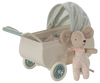 The Maileg Pram With Baby Mouse - Mint features a small toy mouse in a pink polka dot outfit and sleeping bag beside a cream pram with blue wheels and a green-checked canopy, creating a charming vintage look.