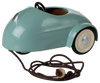 The Maileg Mouse Car in light blue is a small metal car with cream-colored wheels, featuring a pull string with a wooden handle and an open top showing the steering wheel, perfect for transporting mice on imaginative adventures. Ships in one week.