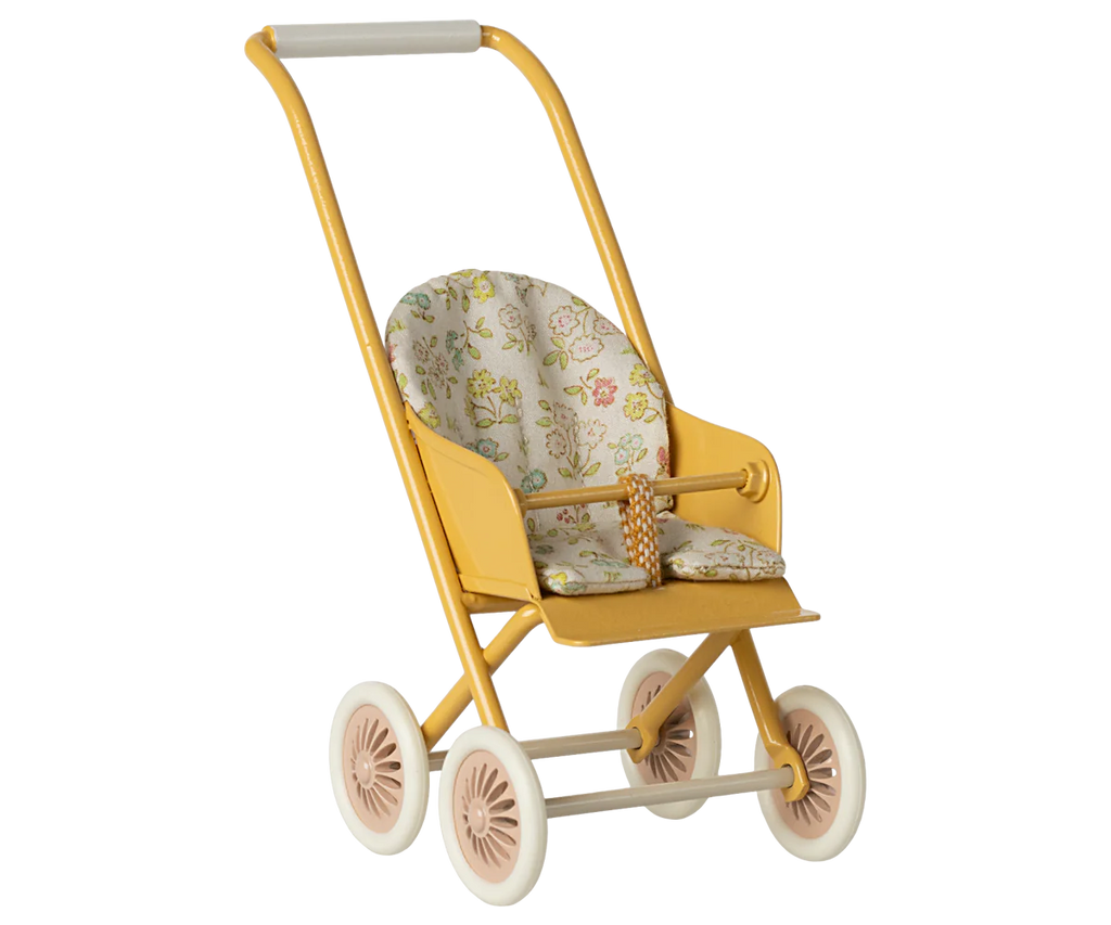 The Maileg Stroller, Micro - Yellow features white wheels and a floral-patterned seat, perfectly sized for dolls or stuffed animals.