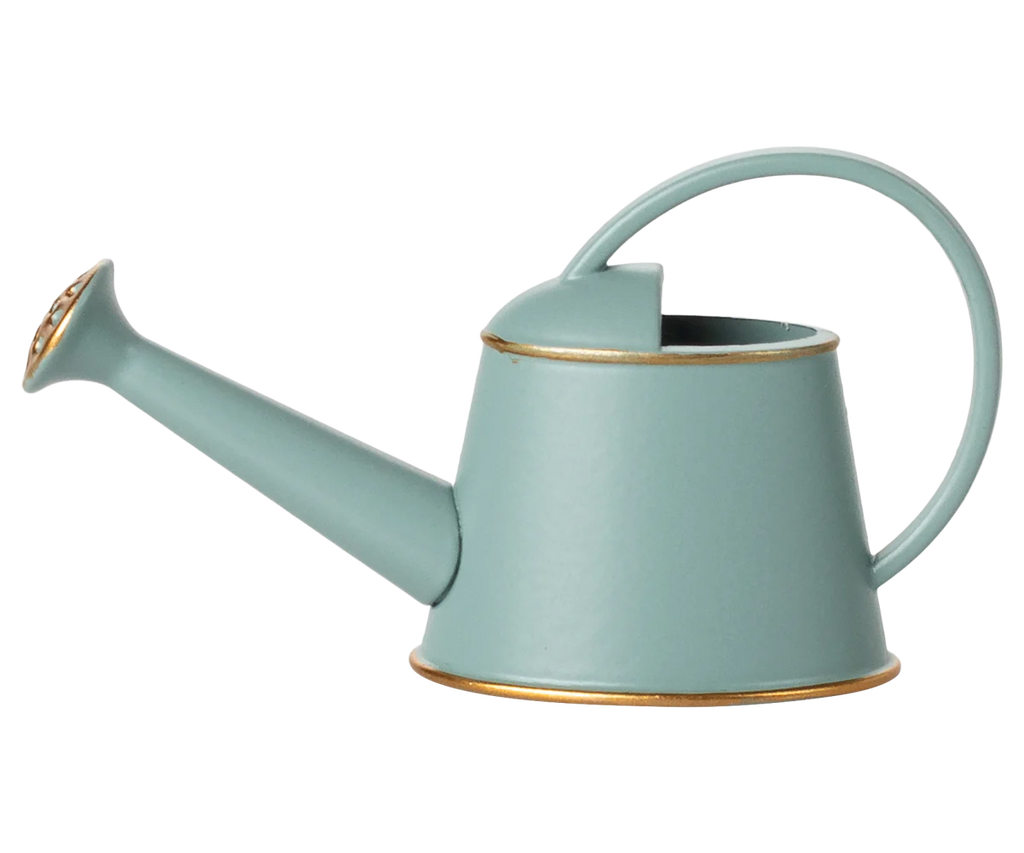 The Maileg Watering Can, Mouse - Light Blue features a gold rim, curved handle, and long spout with a gold rose. It's the perfect accessory for mouse play scenes and gentle watering in your Maileg world.