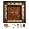 The Monopoly Heirloom Edition features a wooden board set in a walnut cabinet, with cards, dice, deeds, tokens, and paper money. This classic collector's item showcases spaces, Community Chest, Chance cards, and corner squares for enthusiasts.