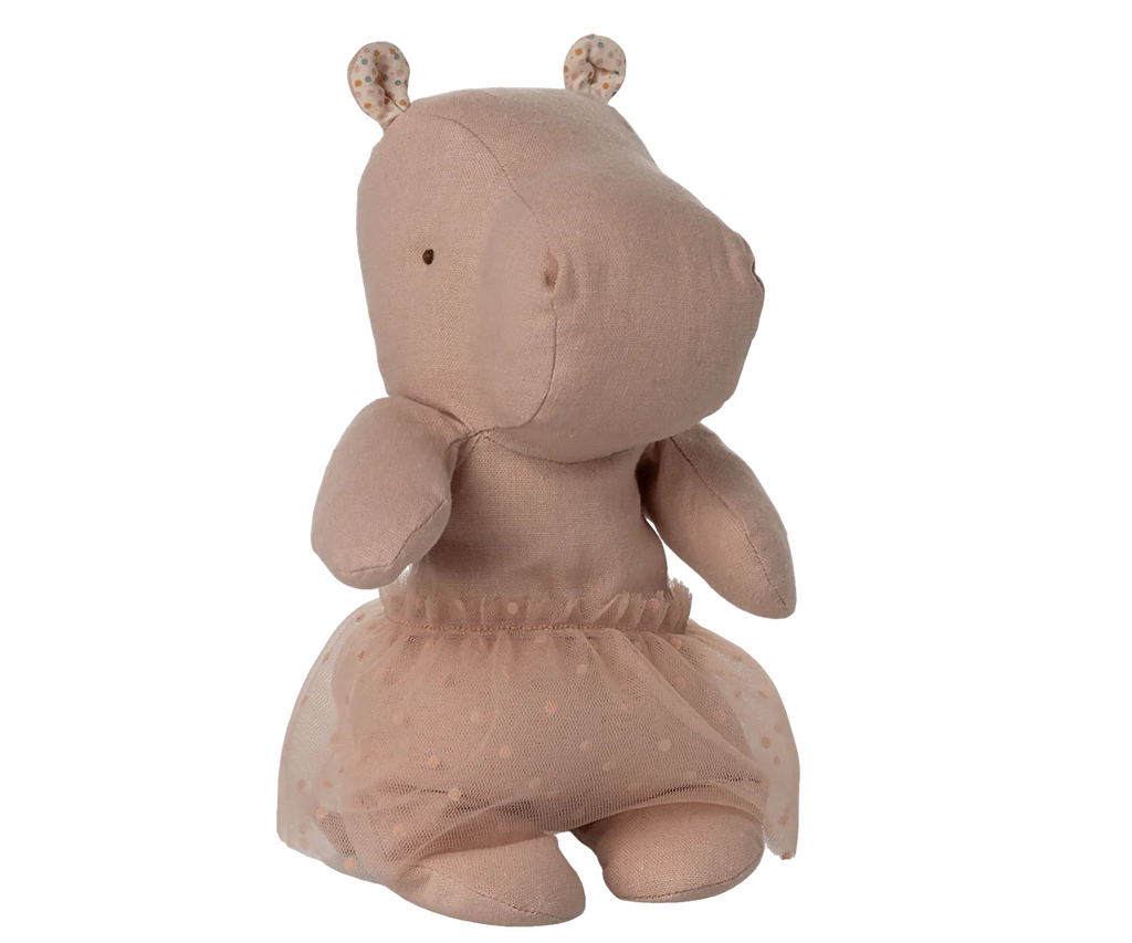 The Maileg Small Hippo With Skirt Stuffed Animal - Soft Rose is a light brown hippo plush from the Safari Friends collection, featuring dot eyes, rounded floral-patterned ears, and a sheer polka-dotted ballerina skirt.