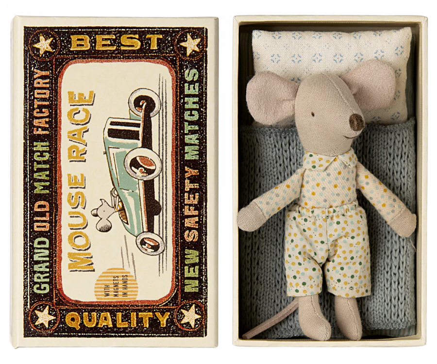 The Maileg Little Brother Mouse comes with polka dot pajamas, nestled in a matchbox-style bed featuring a blue knit blanket and polka dot pillow. The box depicts a vintage car and reads: "Grand Old Match Factory - Mouse Race - Best Quality New Safety Matches.