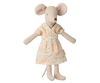 A delightful stuffed toy mouse in a light blue dress with orange flowers is perfectly accented by the warm atmosphere of a nearby Maileg Floor Lamp from the Maileg Living Room Set.