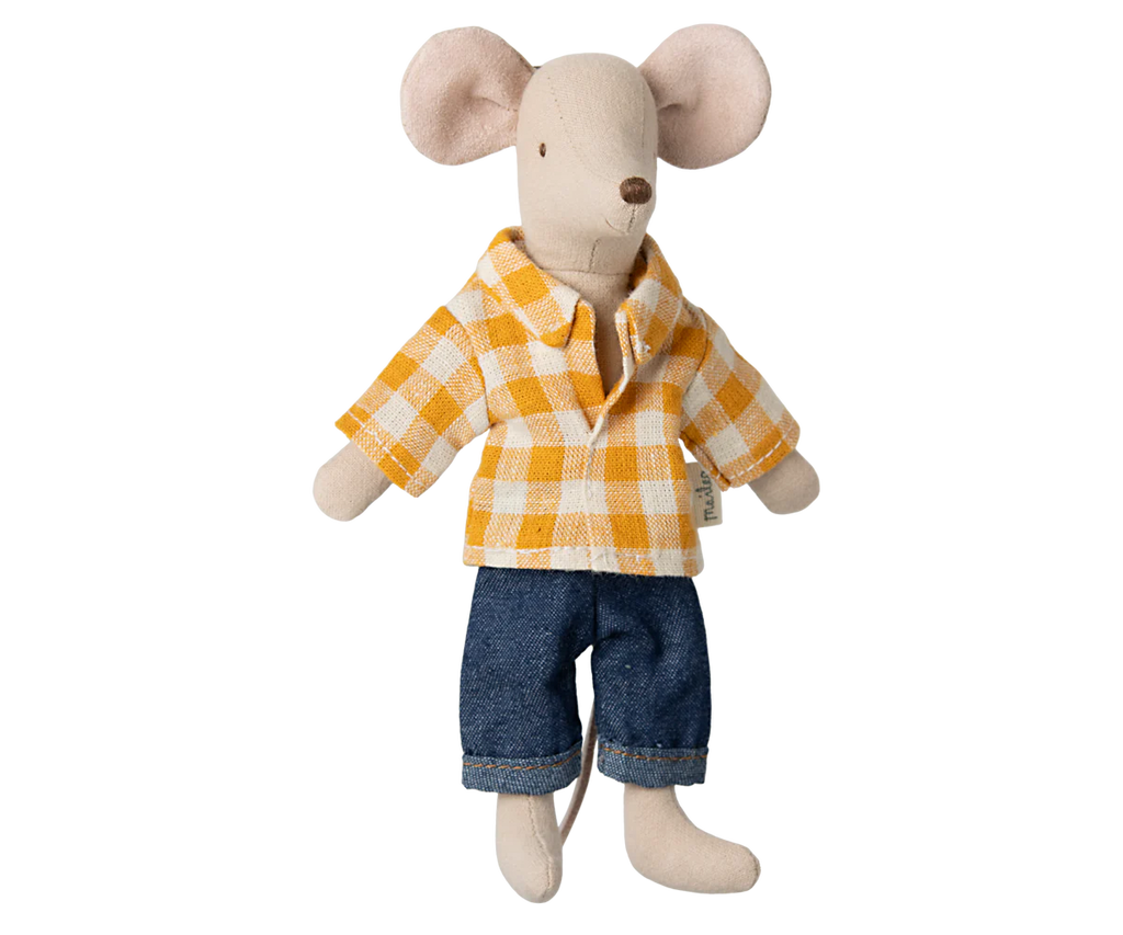 A stuffed toy mouse, dressed in a yellow and white checkered shirt with blue jeans, lounges by a Maileg Living Room Set. The mouse boasts large pink ears and a long tail, enhancing the charm of this cozy scene.