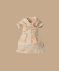 The Maileg Dress For Mum Mouse is a chic, intricately patterned dress with short sleeves and a wrap-style design, featuring a blue and orange paisley print on solid beige—perfect for your little one's wardrobe. Ships in one week.