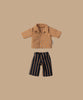 The Maileg Dad Mouse With Extra Outfit includes a small brown collared floral shirt and black pants with vertical brown stripes on a beige background, adding style to Dad Mouse's wardrobe.