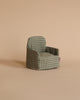 The Maileg Lounge Set features a small green and white checkered armchair on a beige surface with a plain beige background, ideal for a Maileg Mouse or as a charming dollhouse addition.