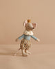 The Maileg Prince Mouse, Big Brother wears a gold crown, blue checkered shirt, brown striped pants, and a white fur collar as he stands against a beige background, resembling a little prince.