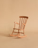 The Maileg Nursery Set features a small wooden rocking chair with curved rockers, perfect for a Maileg Mouse, displayed on a beige surface against a matching beige background.