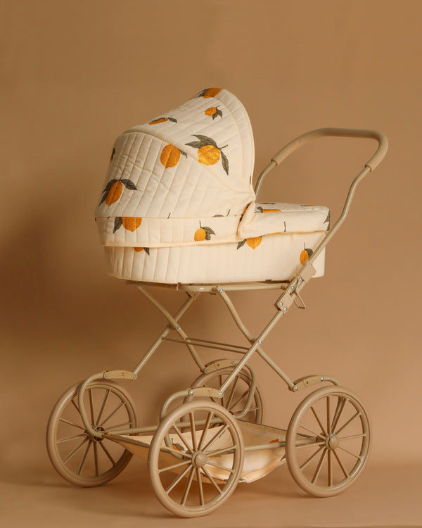 Doll pram with glitter lemon print