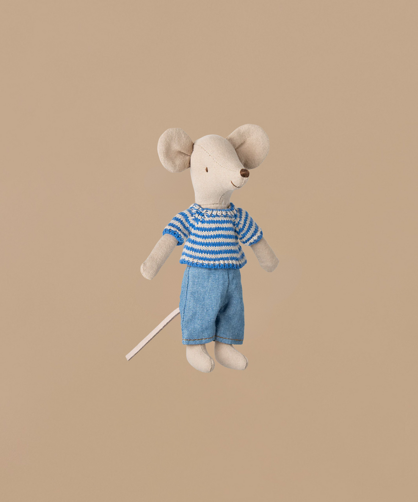 A Maileg Big Brother Mouse, dressed in a blue and white striped knitted sweater and blue pants, sits against a plain beige background. This plush toy features cotton clothes, large ears, and a long tail. The product ships in one week.