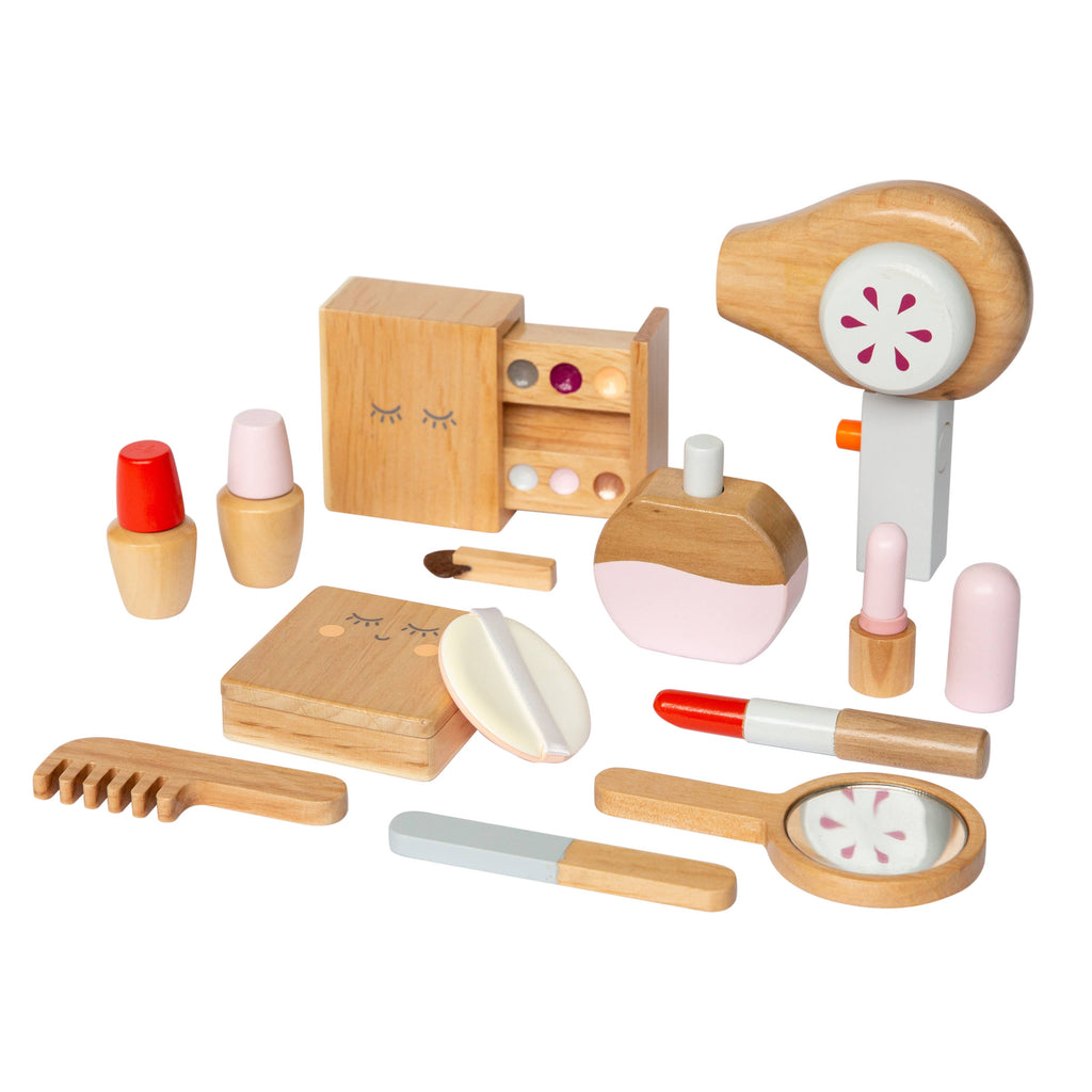 Discover the Wooden Beauty Kit: a timeless toy featuring a hair dryer, comb, lipstick, perfume bottle, and compact mirror. Crafted with non-toxic paint in natural wood tones accented by pink and white, it boasts a playful and minimal design ideal for imaginative play.