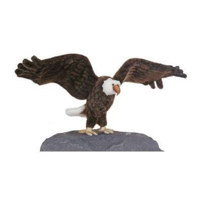 The Large Eagle Stuffed Animal is a model of a bald eagle with detailed brown feathers, a white head, and yellow beak. It has realistic features, outstretched wings, and perches majestically on a rock.