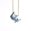 A Galaxy Bear Koala Necklace pendant shaped like a hand-painted blue koala hanging from a 24k gold plated steel chain, set against a plain white background.