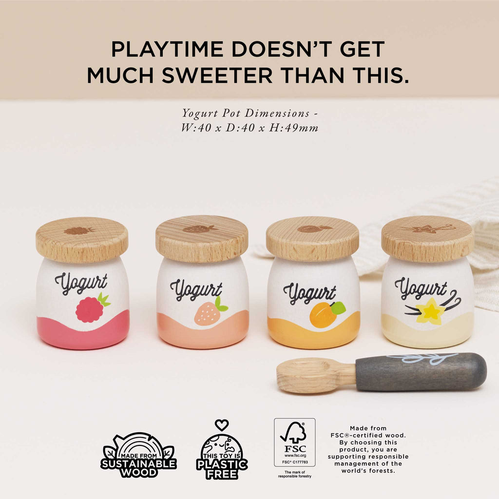 The Yogurt Play Food Pack includes four toy pots with wooden lids, each displaying a fruit design: strawberry, raspberry, peach, and banana. A wooden spoon accompanies them. Text reads, "PLAYTIME DOESN'T GET MUCH SWEETER THAN THIS.