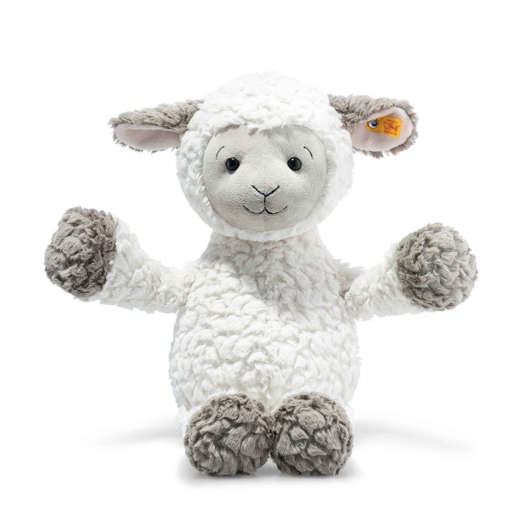 The Steiff Lita Lamb Stuffed Animal - 18" is a fluffy white plush with gray ears, feet, and hands, sitting upright with arms raised and a cheerful smile—an ideal children's gift.