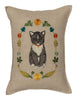Introducing the Coral & Tusk Kitten Cameo Pillow, a decorative masterpiece showcasing an embroidered black and gray tuxedo cat with a red collar, framed by an oval floral wreath in spring hues on beige fabric—adding elegance to any space. Ships in one week.