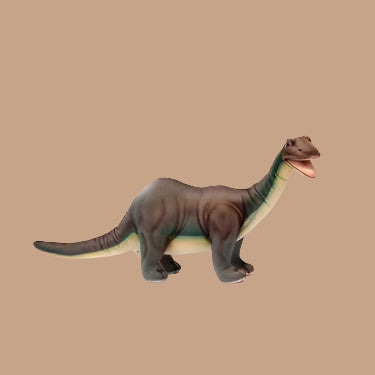 Set against a plain beige background, the Brontosaurus Dinosaur Stuffed Animal stands proudly. With realistic features, this dark brown toy has lighter underparts and an open mouth, highlighting its artisanal hand-sewn craftsmanship.