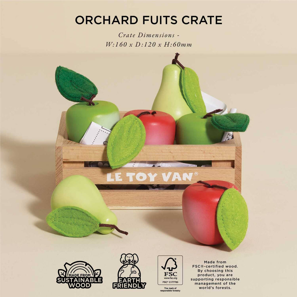 The Orchard Fruits Wooden Market Crate features beautifully arranged wooden toy fruits, including apples and pears with felt accents, inside a small crate labeled "LE TOY VAN." This eco-friendly toy is ideal for early learning and role play.