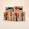 Six Uncle Goose Environments Neighborhood Blocks with colorful illustrations of trees in different seasons and weather conditions, arranged in two rows on a plain background.