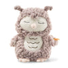 The Steiff Ollie Owl Stuffed Animal is a premium handcrafted plush toy with closed eyes, a light beige face and belly, fluffy light brown fur, small wings, short legs, and embroidered belly details. Soft, cuddly, and perfect for snuggling.