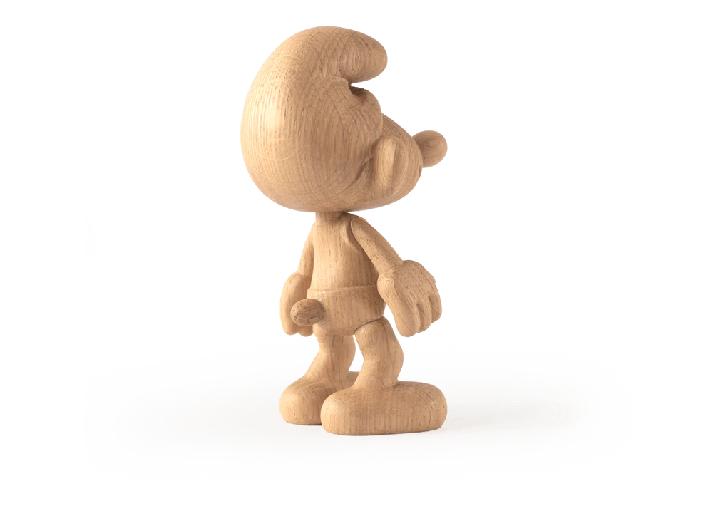 An oak Smurf figure features a small, cartoonish character from Smurf Village with a large, rounded hat and oversized shoes. It stands in profile view on a white background, looking cheerful and ready for new adventures.