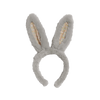 The Olli Ella Fluffle Bunny Headband in Smoke features gray plush ears with a playful floral pattern inside, adding a touch of pink fun, set against a white background.