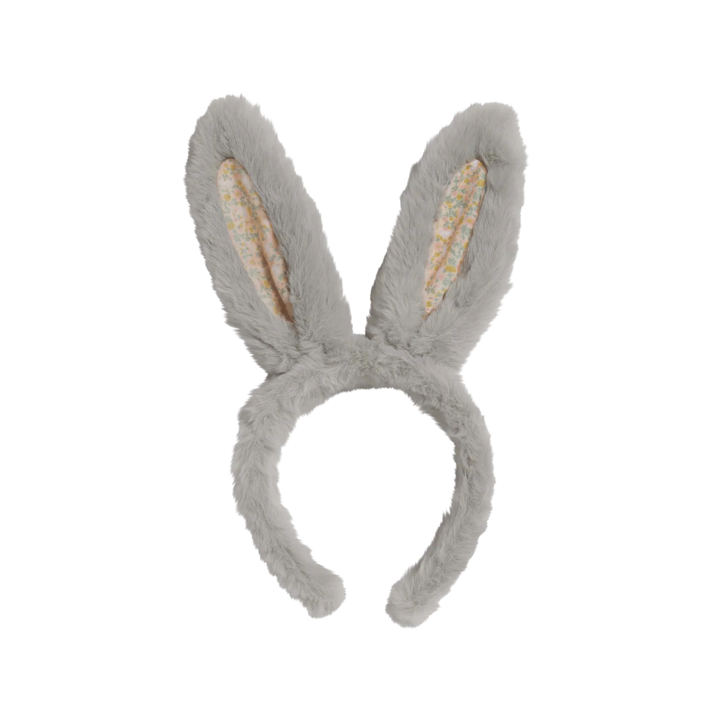 The Olli Ella Fluffle Bunny Headband in Smoke features gray plush ears with a playful floral pattern inside, adding a touch of pink fun, set against a white background.