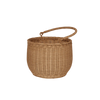 The Olli Ella Gathering Basket is a round, brown rattan basket featuring a woven texture and a sturdy curved handle on top. It's showcased empty against a plain black background.
