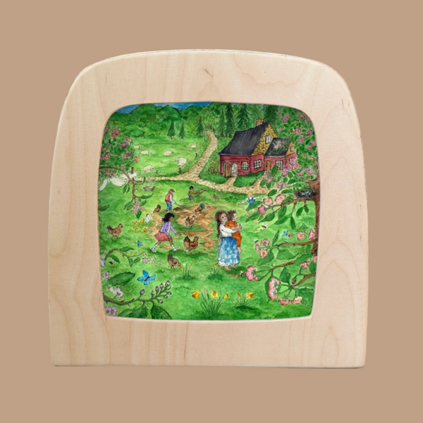 The Silhouette Only - Red Cottage Spring for Toverlux Lamp features a wooden frame surrounding an illustration of people gardening and tending chickens, creating a cozy home ambiance. In the background stands a cottage, nestled among blooming trees and flowers. Vibrant colors bring to life the lively rural scene set under a clear sky.