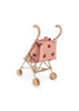 The Konges Sloejd Doll Stroller - Ladybug features adorable floral and ladybug patterns with beige handles and wheels. Its quilted seat fabric adds coziness, while the easy-to-fold design offers convenience, set against a plain white background to highlight its charm.