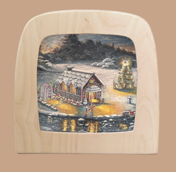 The December Silhouette for the Toverlux Lamp depicts a cozy house with Christmas lights, a decorated tree, snowy landscape, and frozen pond under an overcast sky, creating enchanting silhouettes that enhance the festive glow.