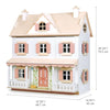 A detailed image of a two-story wooden Humming Bird Dollhouse with pink shutters and a porch. Dimensions are marked: 27.05 inches (68.7 cm) wide, 29.33 inches (74.5 cm) tall, and 16.93 inches (43 cm) deep. The facade features painted floral designs and a pink front door, perfect for any furniture collection.
