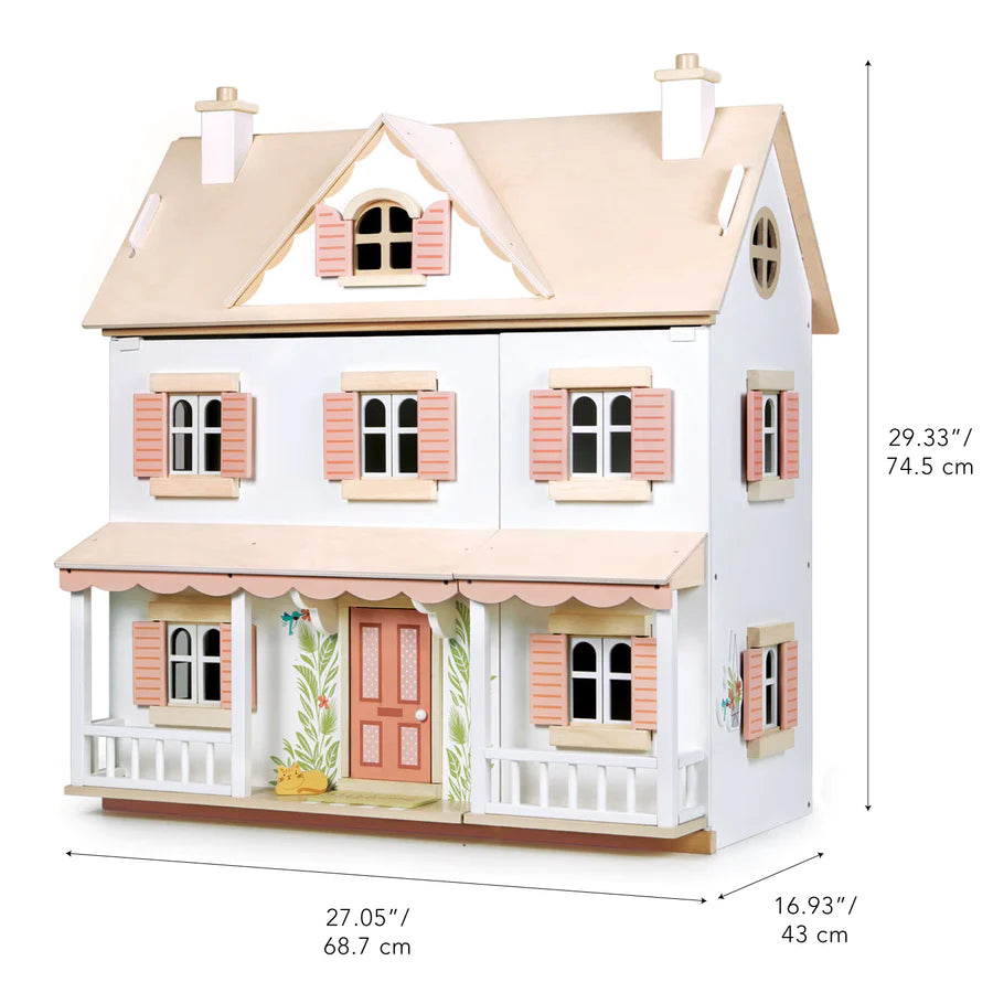 A detailed image of a two-story wooden Humming Bird Dollhouse with pink shutters and a porch. Dimensions are marked: 27.05 inches (68.7 cm) wide, 29.33 inches (74.5 cm) tall, and 16.93 inches (43 cm) deep. The facade features painted floral designs and a pink front door, perfect for any furniture collection.

