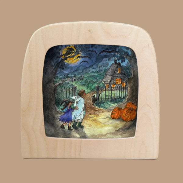 The "Silhouette Only - Trick Or Treat For Toverlux Lamp" depicts a couple silhouetted on a stormy night by a picket fence, cottage with glowing windows, large pumpkins, and a gnarled tree branch reaching towards the full moon. Ships in one week.