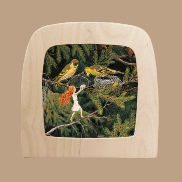 The illustration, titled "Silhouette Only - The Sun Egg Silhouette - Birds for Toverlux Lamp," depicts a small fairy with red hair on a tree branch, offering a flower to yellow birds in a nest. Her glimmering wings add ethereal charm, framed by a light wooden border against a beige background.
