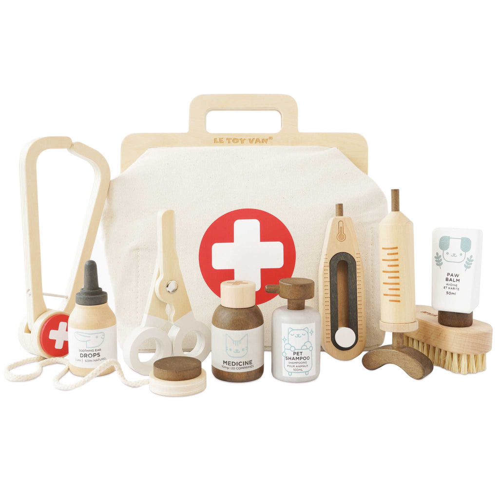 The Pretend Play Animal Vet Set comes with a canvas bag marked with a red cross and includes a toy stethoscope, syringe, thermometer, medicine bottles, paw balm, and more—ideal for veterinary career role play.