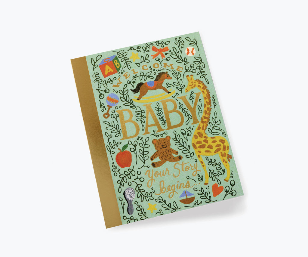The Storybook Baby Card features metallic gold foil trim and playful animal, toy, and plant illustrations. "BABY Your Story begins" appears in decorative text on a light green background. The blank interior is perfect for your own message.