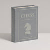 Chess Vintage Bookshelf Edition is a gray book-shaped box with a white knight chess piece on the cover. This collectible strategy game is for 2 players, ages 8 and up.