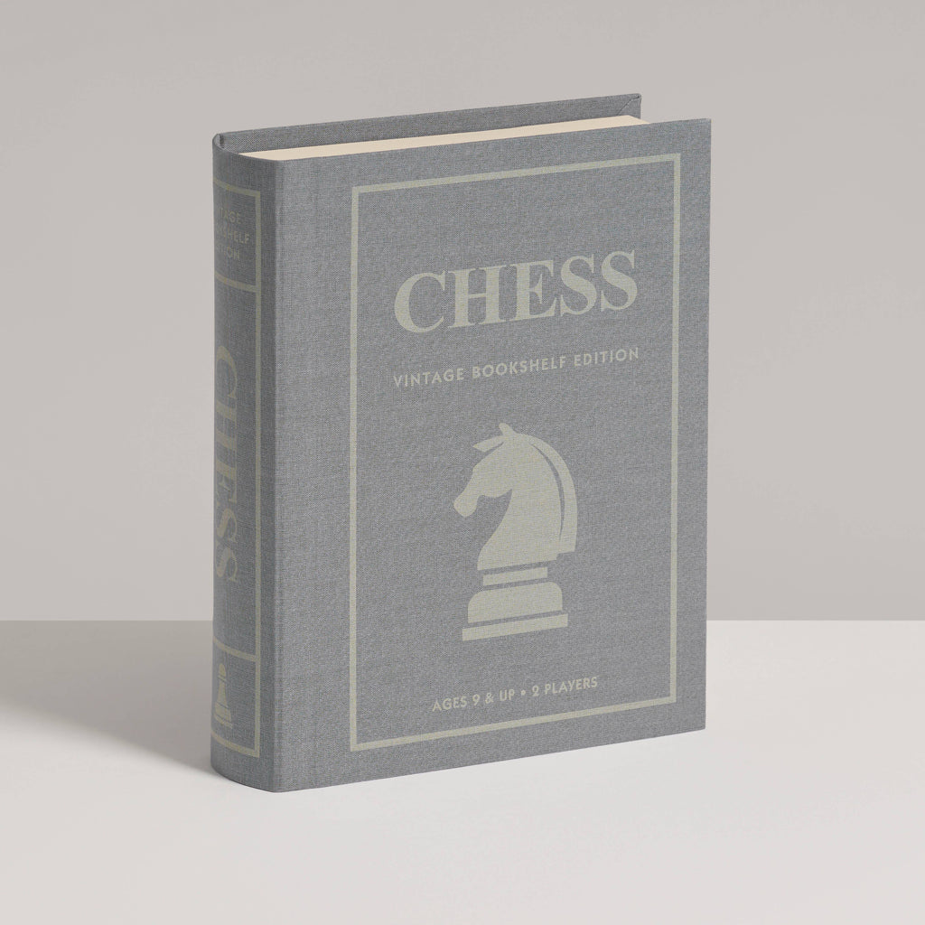 Chess Vintage Bookshelf Edition is a gray book-shaped box with a white knight chess piece on the cover. This collectible strategy game is for 2 players, ages 8 and up.