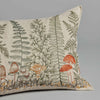 Coral & Tusk Mushrooms and Ferns Lumbar Pillow with an embroidered botanical print featuring detailed illustrations of ferns and various mushrooms on a neutral background.
