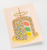 The Layer Cake Card features a tall, sprinkle-covered cake with colorful layers, gold foil accents, a lit candle, and a “Happy Birthday!” banner on a light background. Its blank interior is perfect for your personal message.