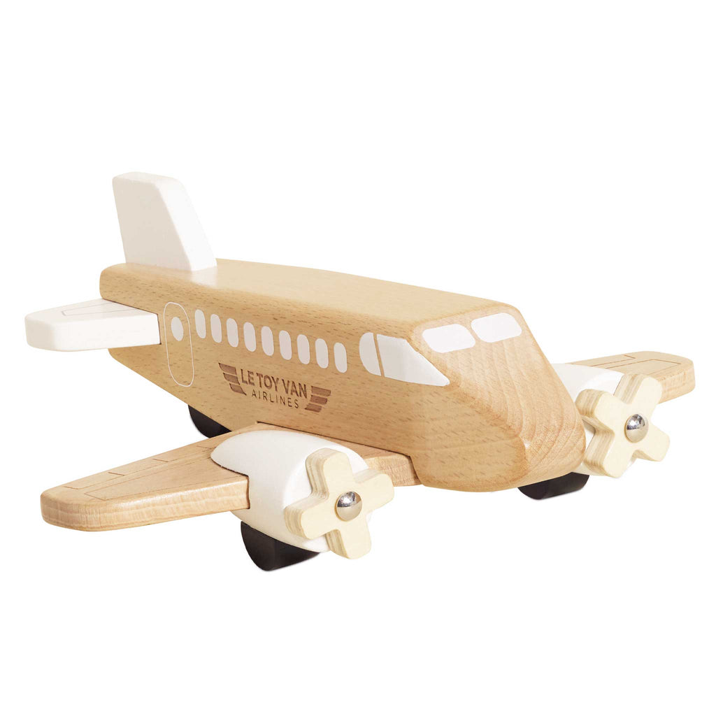 The Wooden Toy Plane is made from FSC-certified wood, plastic free, with white accents, small propellers, black wheels, and "Le Toy Van Airlines" on the side. It features a smooth design perfect for imaginative play.