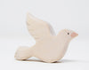 The Handmade Wooden Dove is crafted from sustainable hardwood, featuring simple details like a pointed beak and outlined wings, enhanced by natural plant-based stains. It's an exquisite piece against a plain white background, perfect for any bird collection.