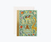 The Storybook Baby Card features colorful animal, baby block, and leaf illustrations. "BABY" appears in gold foil with "Your story begins" below. This card is blank inside and comes with a white envelope.