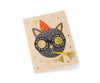 The Birthday Cat Card features a black cat in a red and yellow party hat with round glasses, "Happy Birthday" and "You're One Cool Cat" text, gold star accents, metallic foil stamping, and a blank interior for your message.