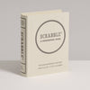 The Scrabble Vintage Bookshelf Edition is a cream-colored, book-shaped box that stands upright and features premium game components. It’s designed for 2–4 players ages 8 and up.